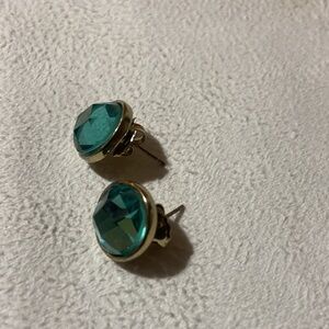 Blue earrings on gold